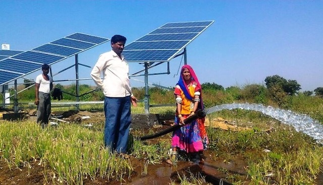 farmer family standing with solar water pump by shree Laxminath solar water